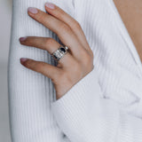Mechanism Ring with Oval Facet Black Spinel and White Topaz