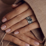 Mechanism Ring with Oval Facet Black Spinel and White Topaz