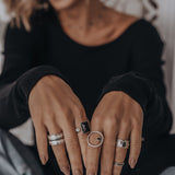 Mechanism Ring with Oval Facet Black Spinel and White Topaz