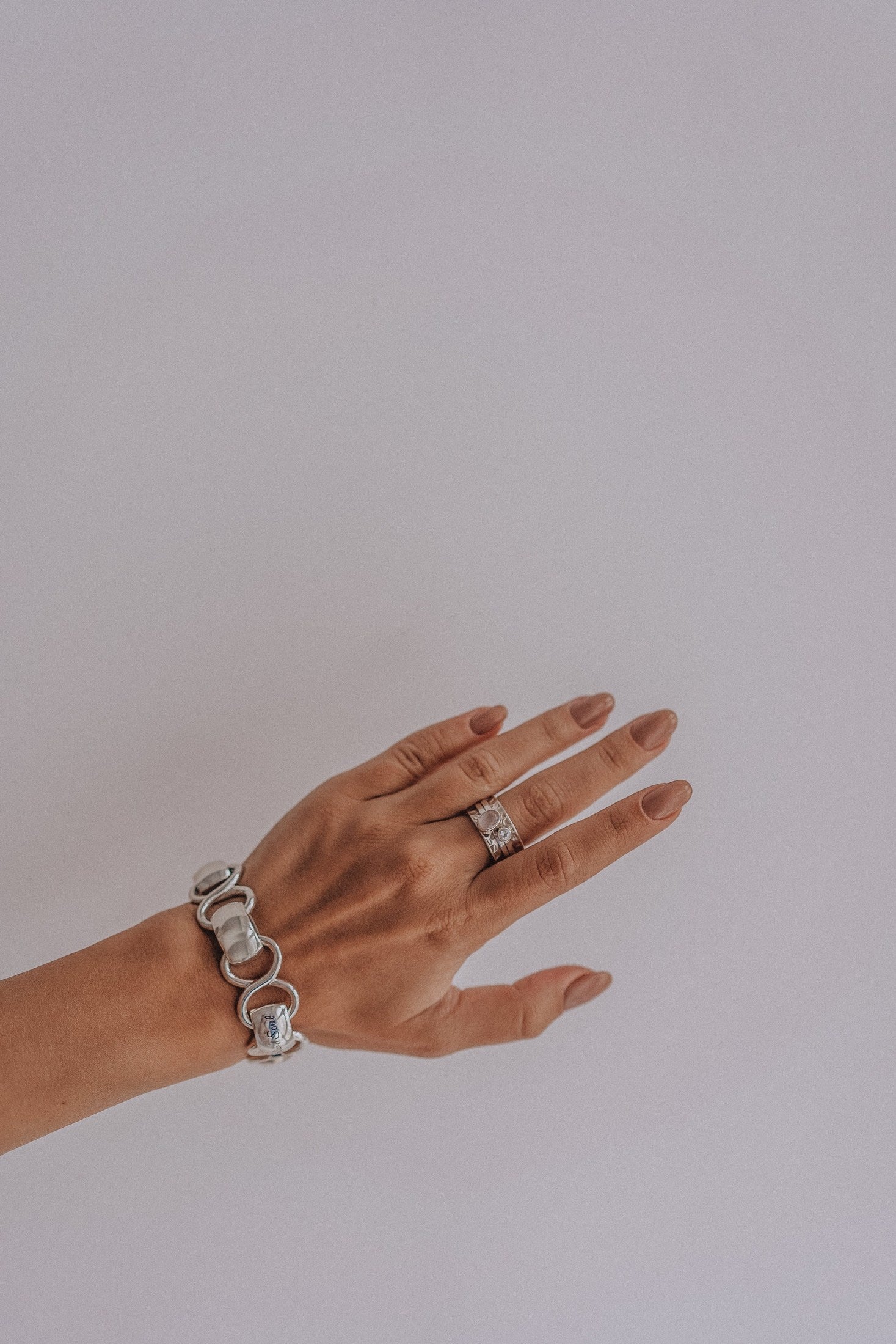 Mechanism Ring with Oval Cabochon Rose Quartz and White Topaz
