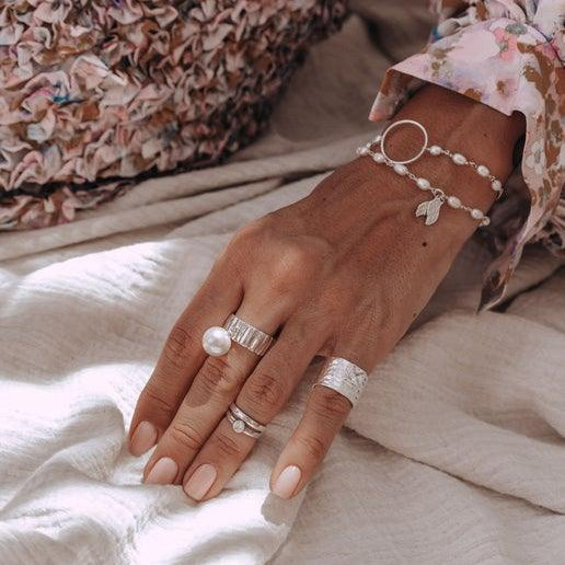 Infinity Bracelet With White Pearls